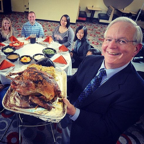 Ted Polk serves up Thanksgiving turkey, a UIndy tradition.