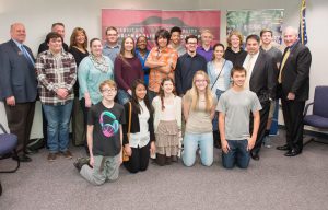 A ceremonial contract-signing and news conference featuring UIndy President Rob Manuel, Vincennes President Chuck Johnson and Perry Township Superintendent Tom Little announcing an innovative partnership that will help local high-schoolers transition more conveniently and efficiently to higher education was held at Perry Meridian High School on January 27, 2016. This is a group shot with PMHS students attending the event. (Photo: D. Todd Moore, University of Indianapolis)