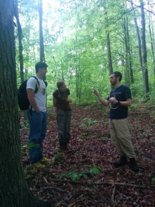 UIndy students Tyler Ploss '16 and Elizabeth Wells '16 with Biology Prof Marc Milne.