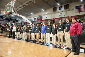 Christel DeHaan Academy students enjoy a meal and ballgame during Pack the House night, and were recognized on the floor during a time out in the men's game on Thursday, Feb 16, 2017. The students have the opportunity to get fully paid tuition scholarships to UIndy. (Photo by D. Todd Moore/University of Indianapolis)