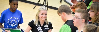 Madi (Madison) Kovacs presented podium medals at the Indiana Special Olympics Youth Basketball state finals in March 2017. (Photo by D. Todd Moore)