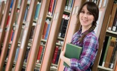 Lauren Judd, UIndy undergraduate and master's degree holder, is headed to Stanford to pursue her PhD in History. She poses for photos in the Krannert Memorial Library on Wednesday, May 24, 2017. (Photo: D. Todd Moore, University of Indianapolis)