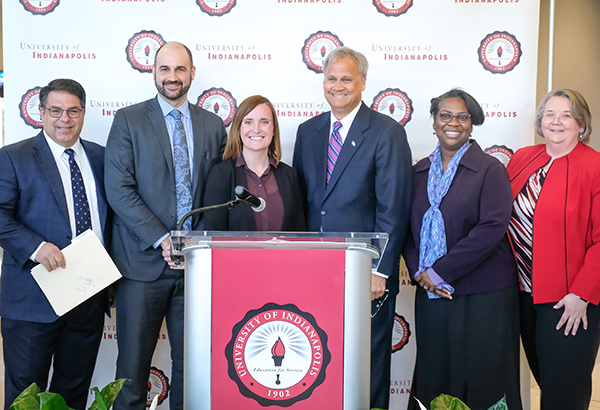 Featured speakers at the press conference included (from left) President Robert L. Manuel; Paul Babcock, Director of Indianapolis Office of Public Health and Safety; Rachel Halleck, Senior Director of Behavioral Health Services at Volunteers of America; State Senator James Merritt; Anita Thomas, Dean of the College of Applied Behavioral Sciences, and Norma Hall, dean of the School of Nursing. Photo:  D. Todd Moore.