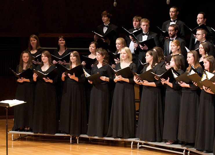 UIndy Choirs singing and performing on Ruth Lilly Performance Hall stage in CDFAC.