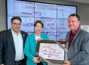 President Rob L. Manuel, left, with Pamela '84 and Edwin Qualls '84.