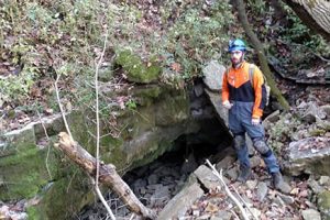 Marc Milne, assistant professor of biology at the University of Indianapolis, outside the Stygeon River Cave in southern Indiana.