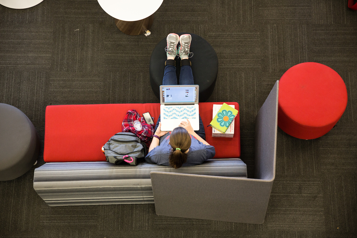 student in library