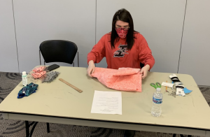 A student volunteers during a service project to bring 200 care packages to University Heights neighbors during the coronavirus lockdown.