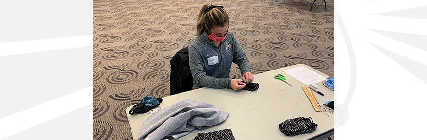 A student volunteers during a service project to bring 200 care packages to University Heights neighbors during the coronavirus lockdown.