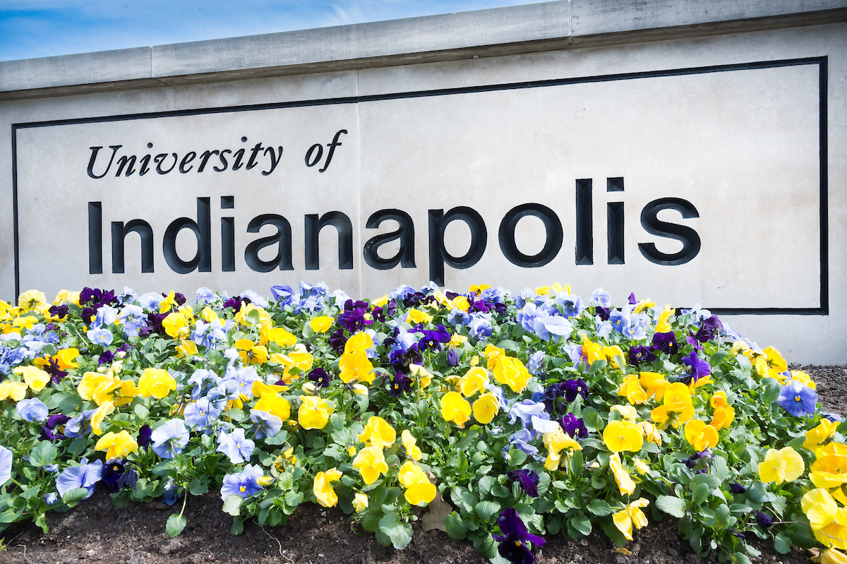 University of Indianapolis sign with flowers