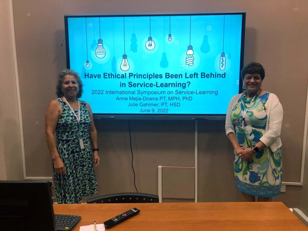faculty members standing in front of a screen that reads: Have Ethical Principles Been Left Behind in Service-Learning?