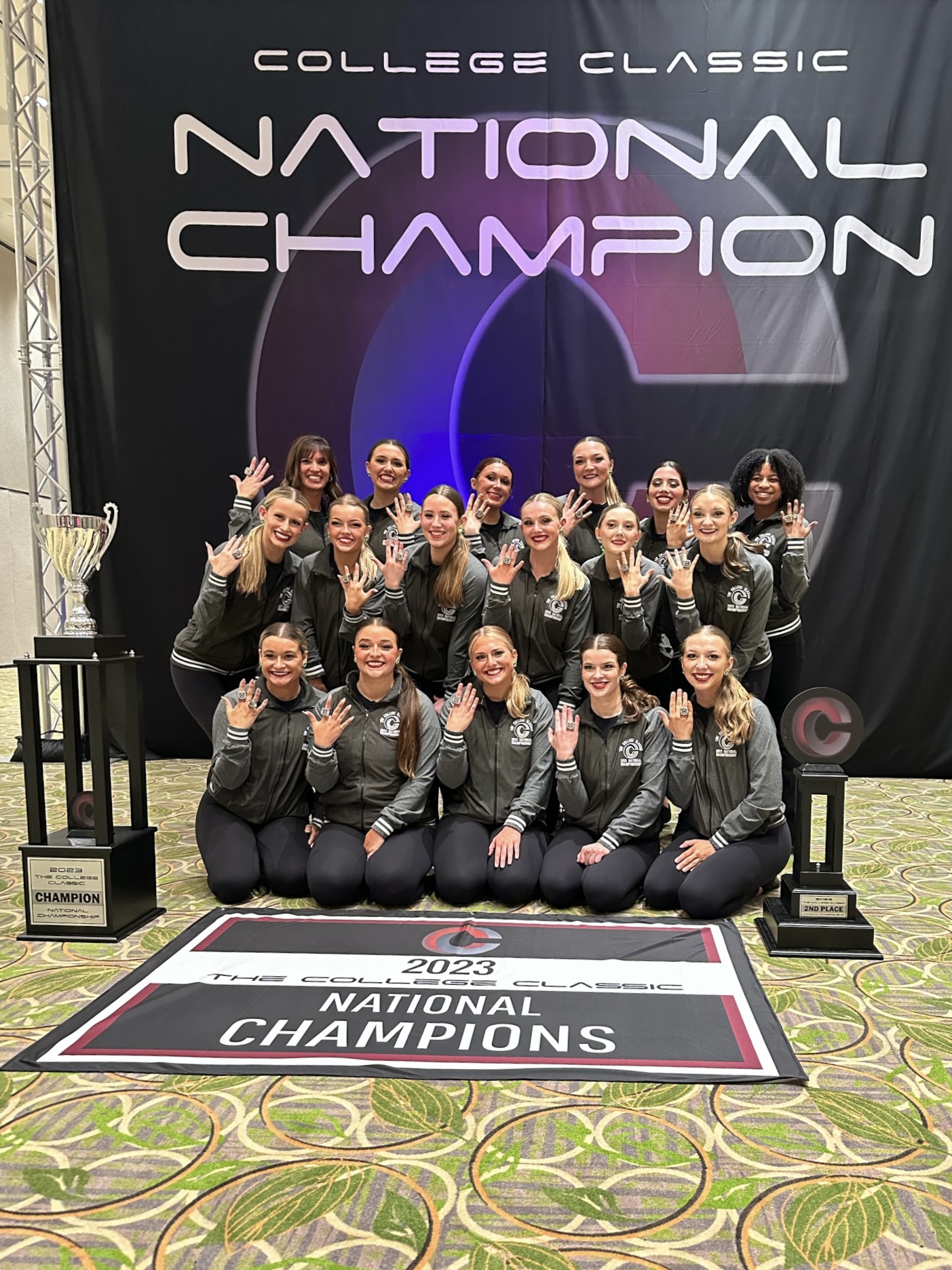 uindy dance team poses as national champions