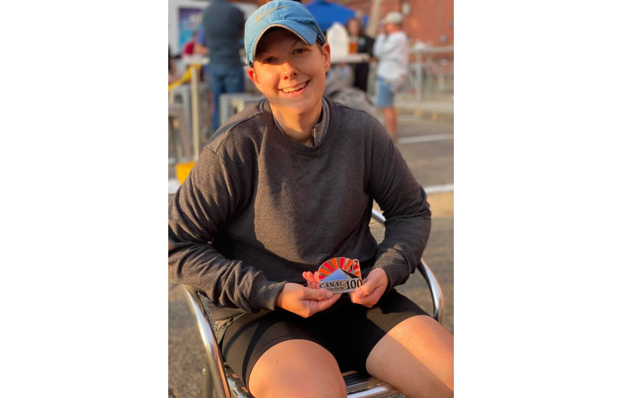 Laura Santurri poses with medal from Canal Corridor Run