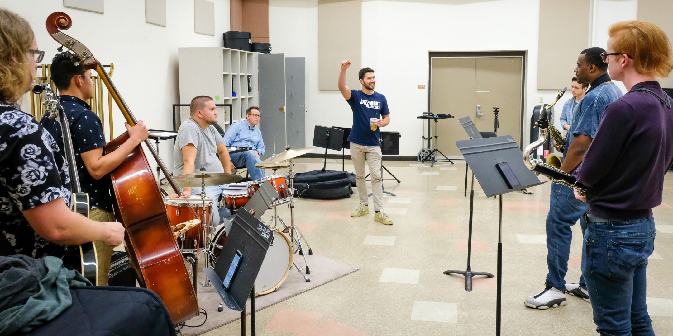 Music students listening to instruction prior to performing.