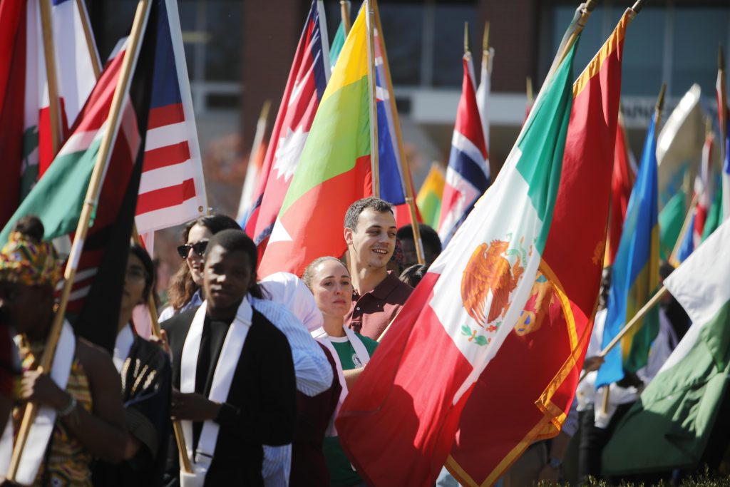 Students prepare for the flag processional at Celebration of Flags