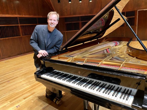 Photo of pianist Gregory Martin, with piano