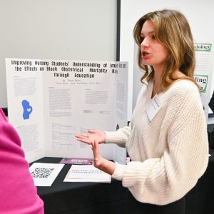 Mallory Barnes presents her research project at Philanthropy Lunch