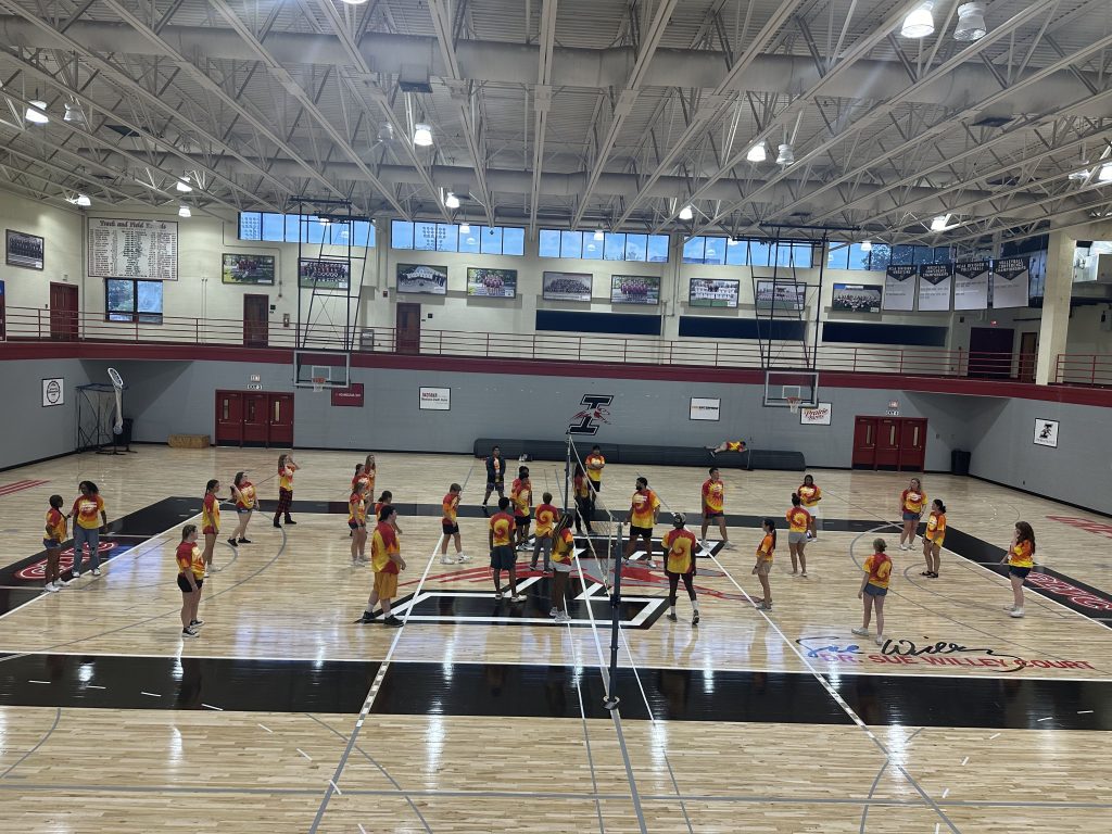 Students in the 2024 UIndy Summer Success Camp play volleyball on the Sue Willey Court