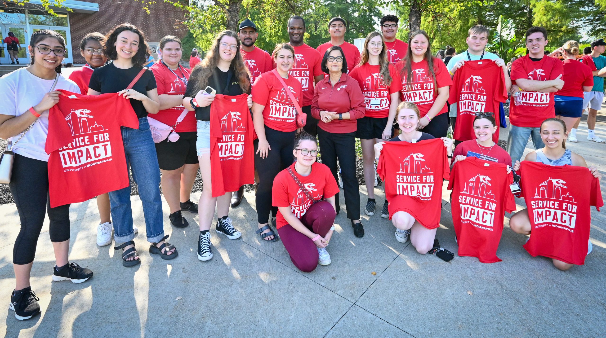 Group photo of President Tanuja Singh and UIndy students on Service for Impact Day