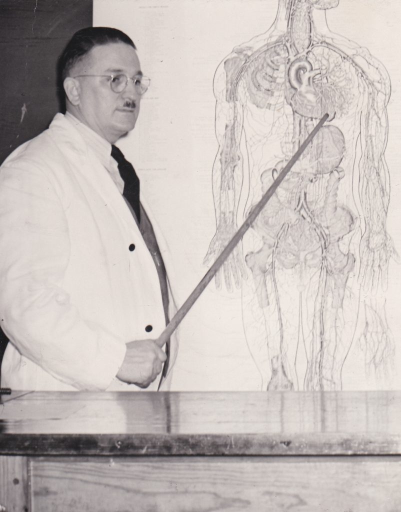 Dr. William Pitt Morgan teaching biology in a classroom. Courtesy: Frederick D. Hill Archives