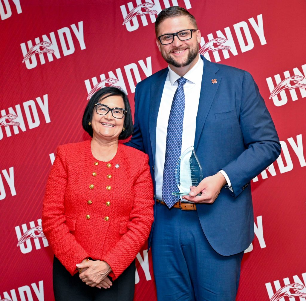 Photo of Joseph Britner with President Tanuja Singh