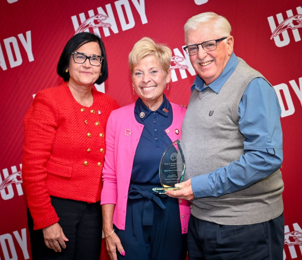 Photo of Mary Beth and Fred Bagg with President Tanuja Singh