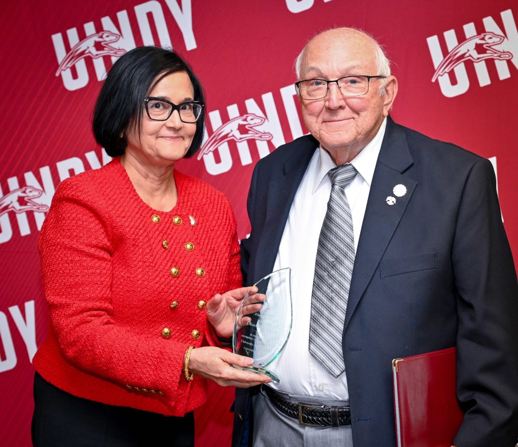 Photo of Charlie Burris and President Tanuja Singh