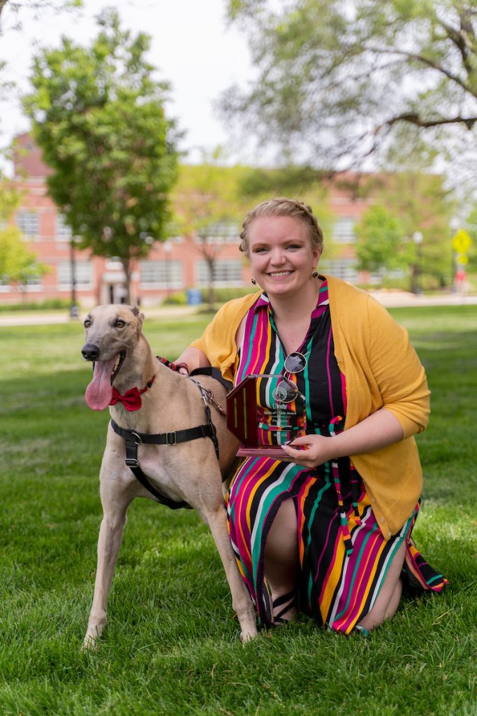 Photo of Coran Sigman and Grady the Greyhound