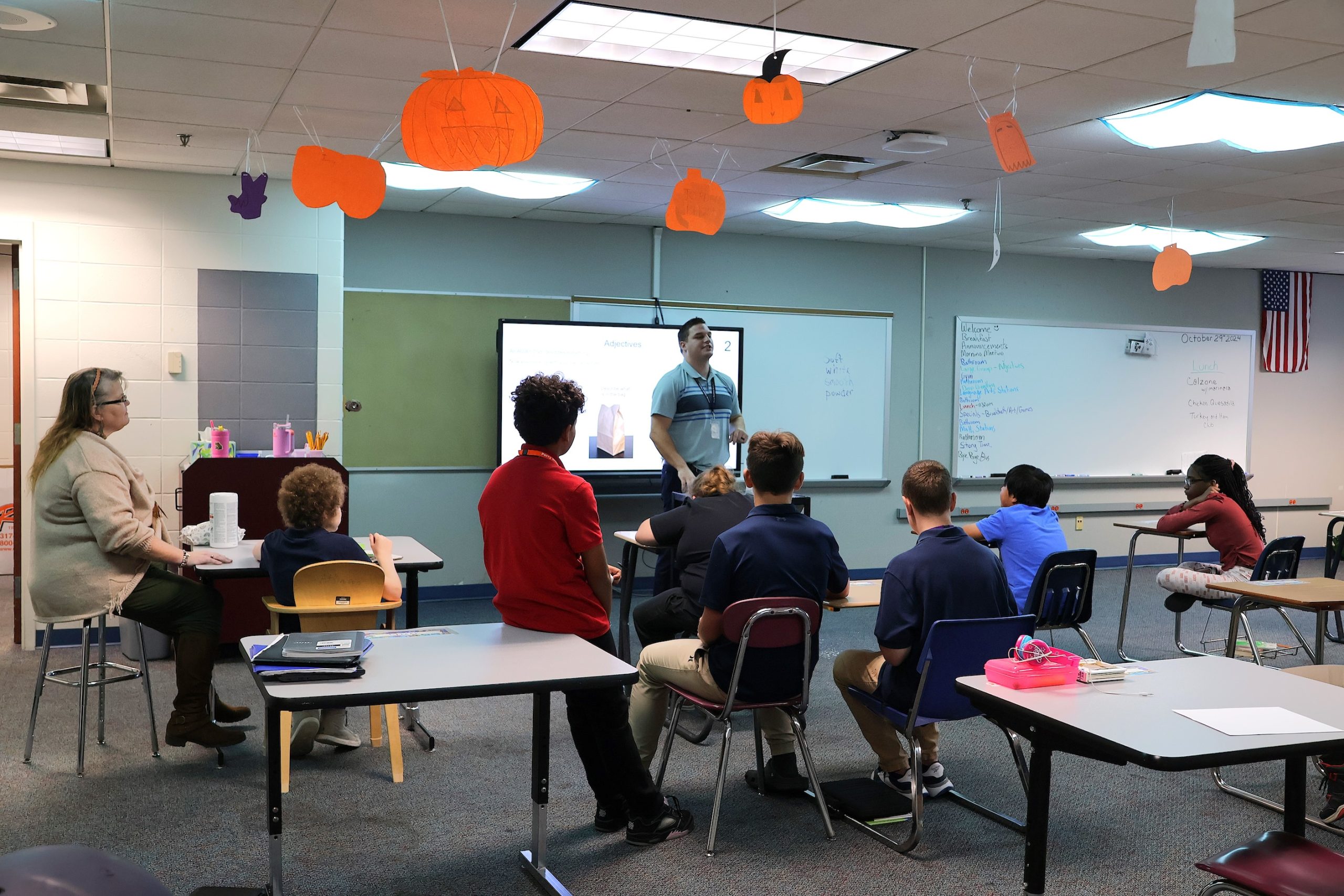 Special education teacher (and I-SEAL participant) Andrew Bova helps his class learn about adjectives by describing items from a bag at Perry Meridian Middle School.