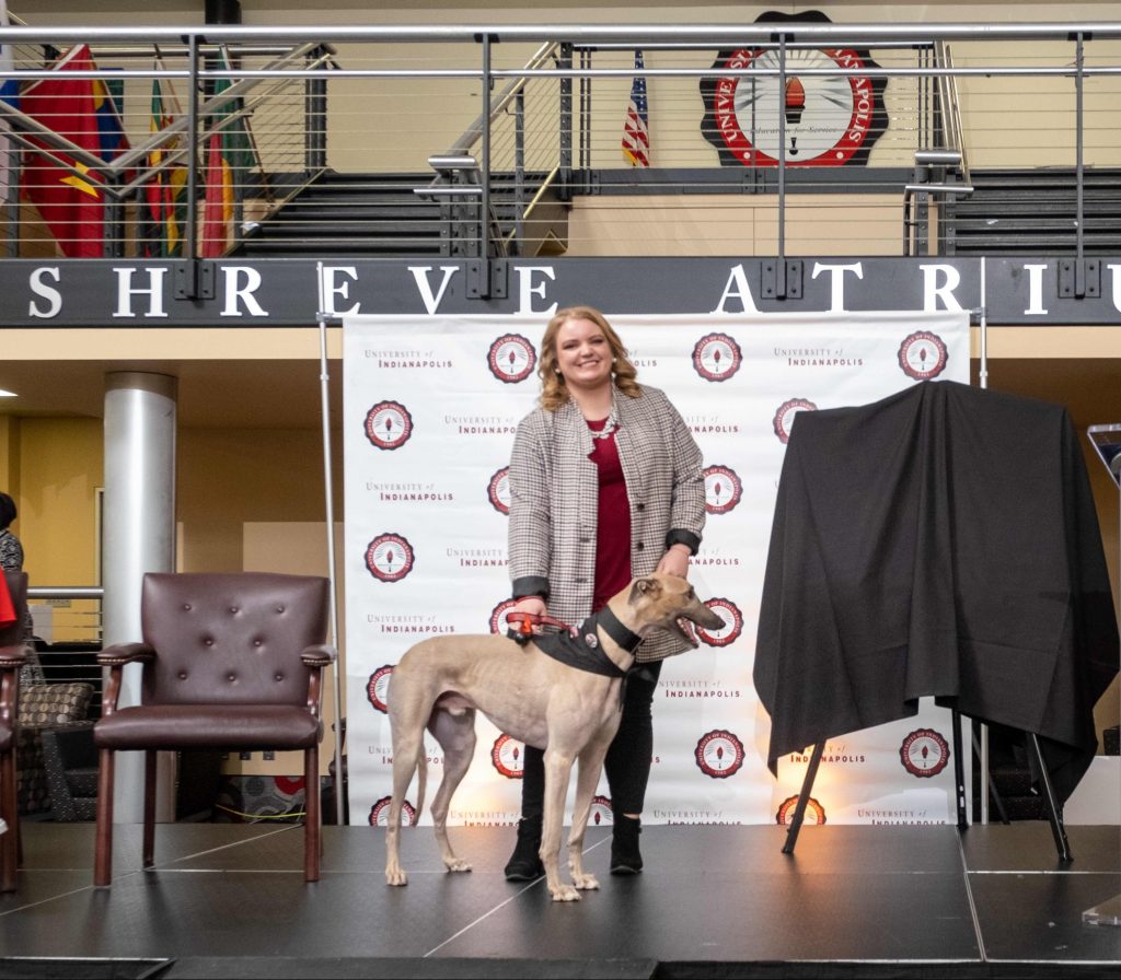 Photo of Coran Sigman with Grady the Greyhound at his debut