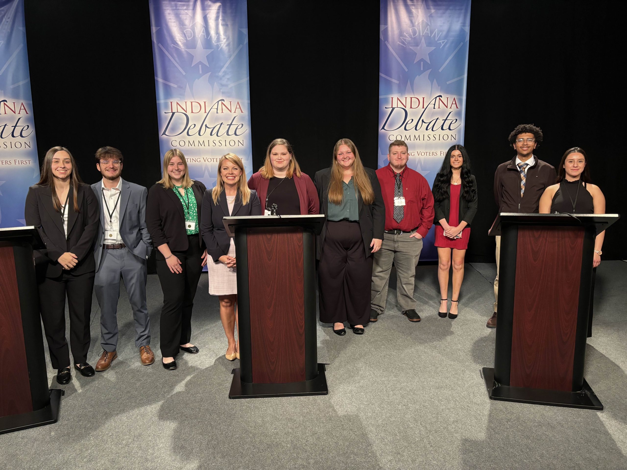 Group photo of Dr. Laura Wilson with her class at the 2024 Indiana Gubernatorial Debate