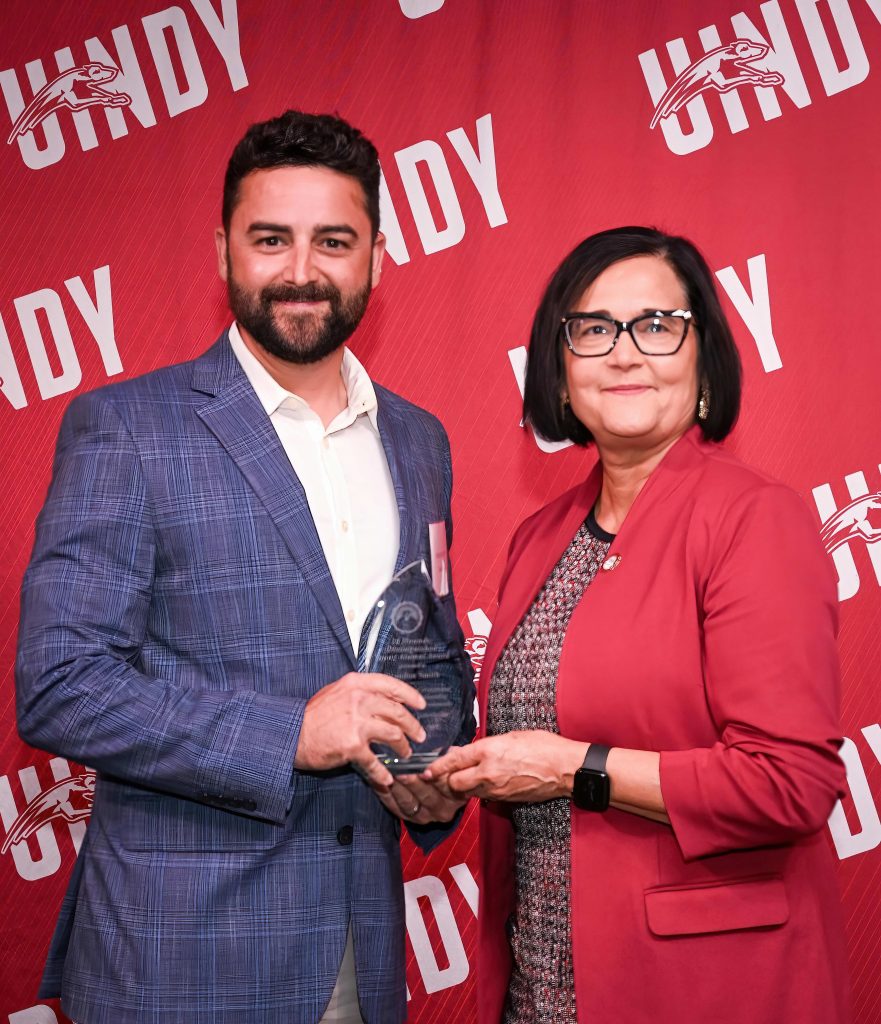 Photo of Brandon Smith with UIndy President Tanuja Singh