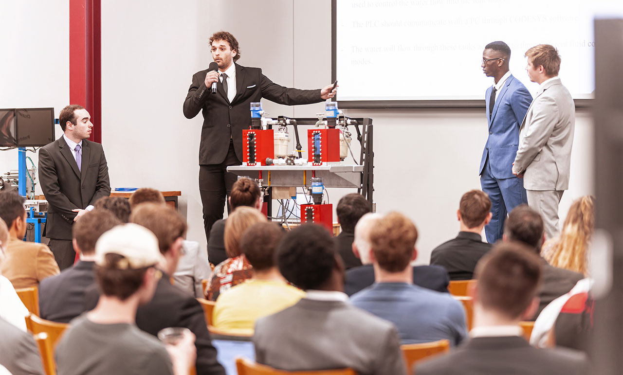 UIndy engineering students presenting as part of DesignSpine