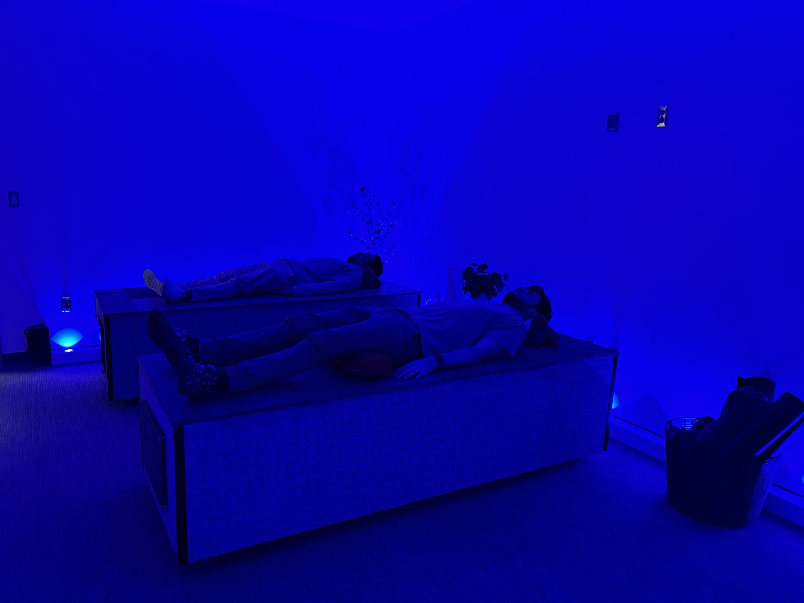 Two people relax on one of the lava beds inside UIndy's Biofeedback & Meditation Center on campus.