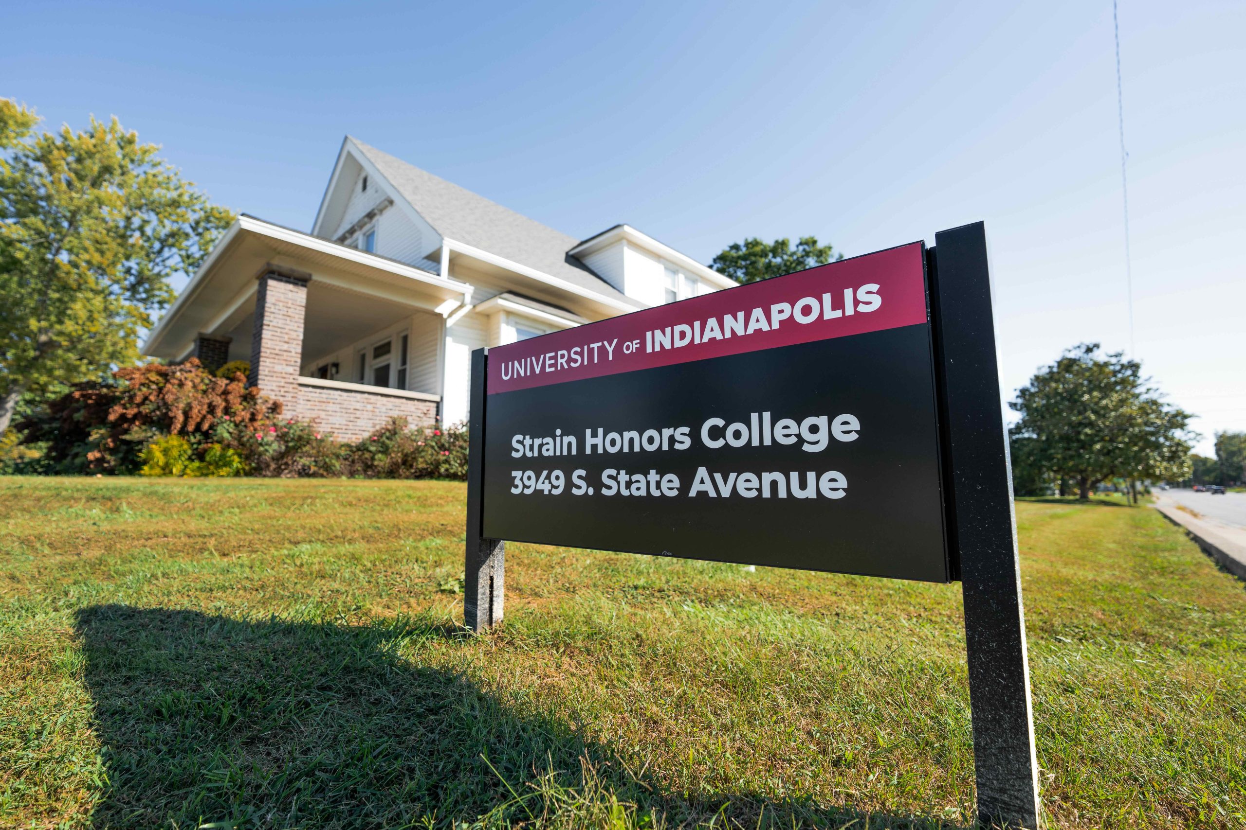 Street sign indicating the Strain Honors House located at 3949 S. State Avenue