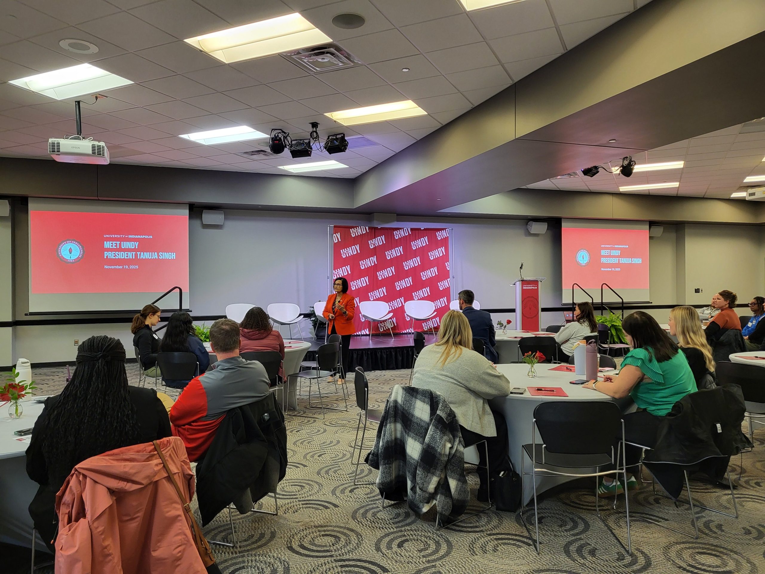 Photo of Dr. Tanuja Singh addressing corporate partners at Meet UIndy