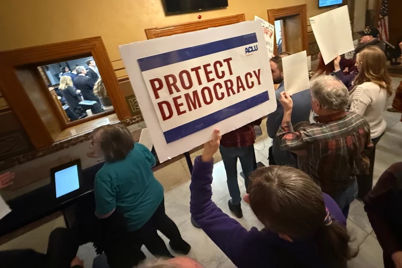 Protesters gather outside the Senate chamber at the Indiana statehouse in Indianapolis as senators meet during a special session to vote on a new congressional map on Monday. Obed Lamy/AP