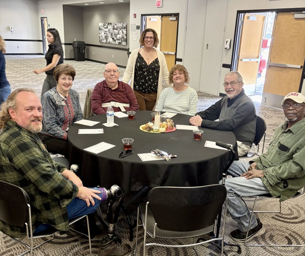 Table of Community Resource Group volunteers with Dr. Alissia Garabrant