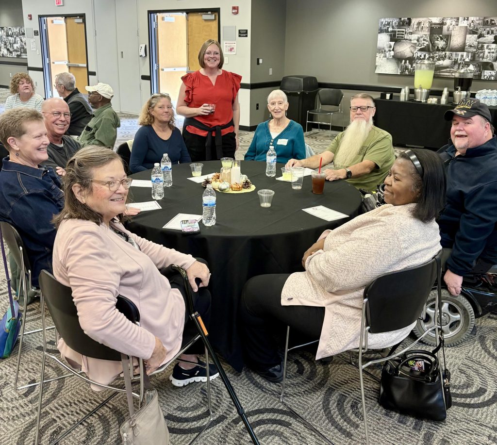 Table of Community Patient Resource Group volunteers with Dr. Kristina Watkins