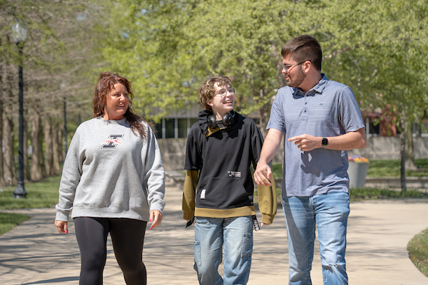 Build Program Director Betsy McGill with two students in the program
