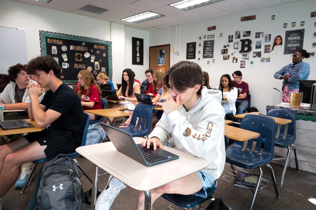 A high school student sits in class as part of the Early College program