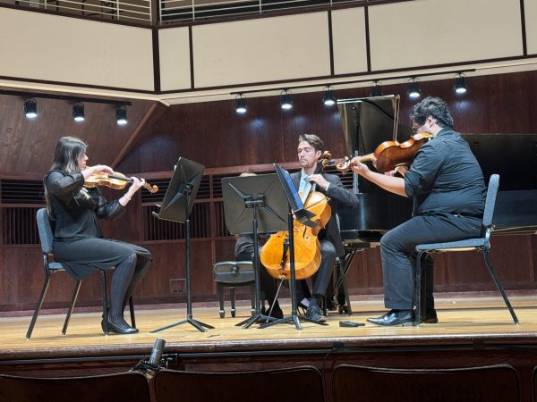 String trio performing on Ruth Lilly Performance Hall stage in CDFAC