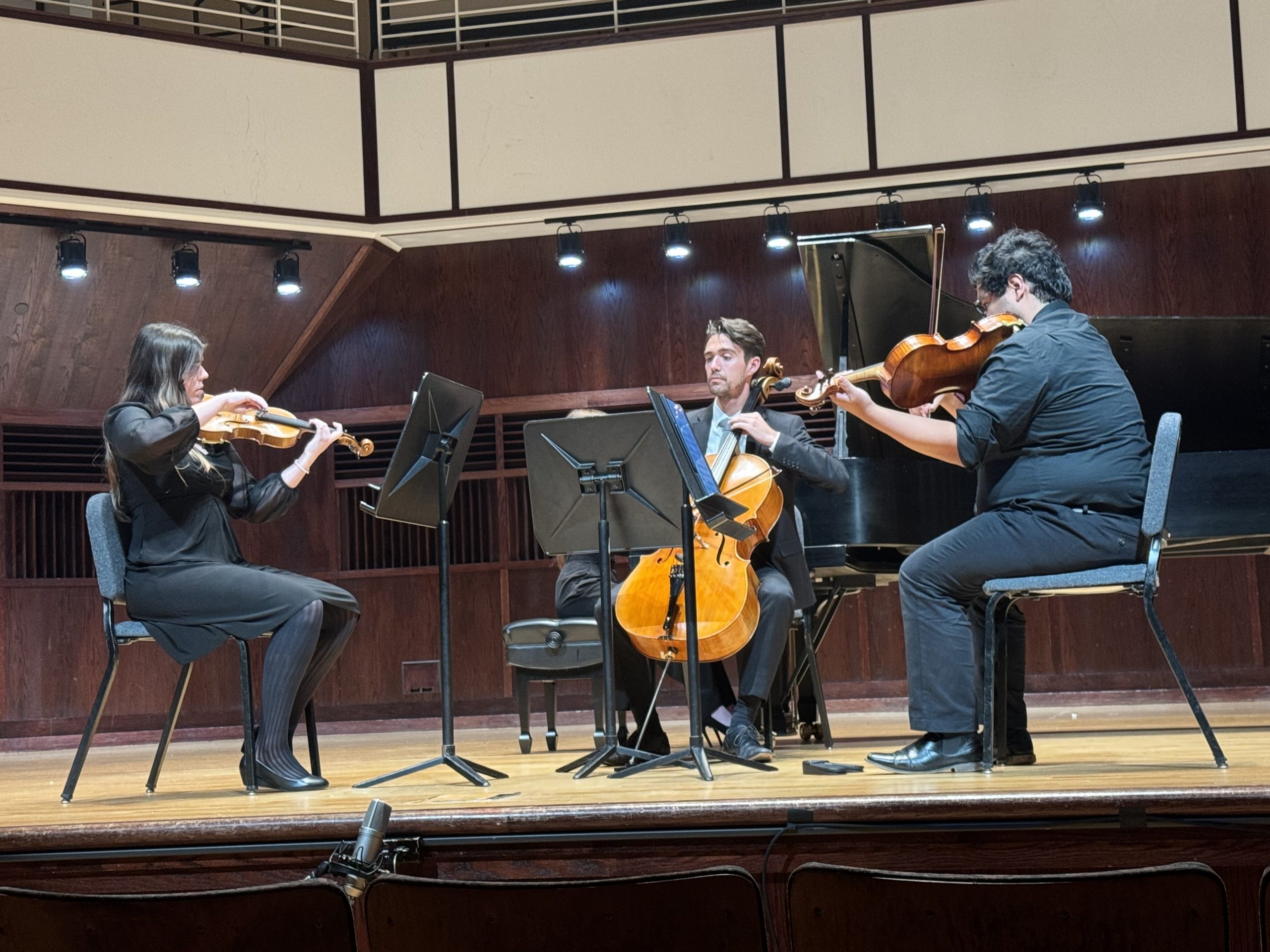 String trio performing on Ruth Lilly Performance Hall stage in CDFAC