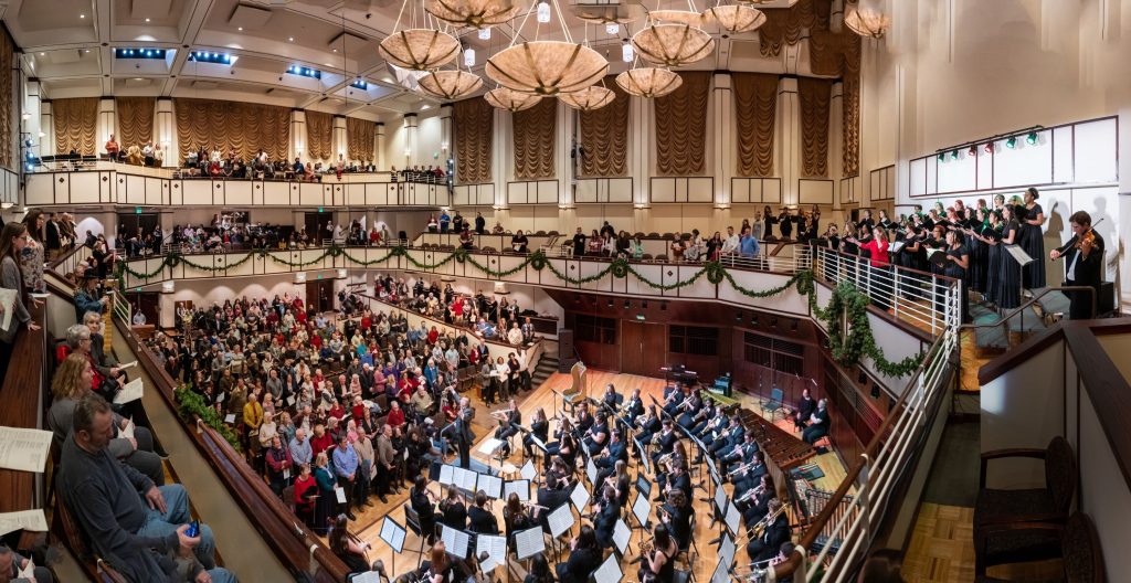 Music Department students performing in UIndy Music Dept Annual Christmas Celebration in front of a large audience